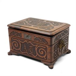 Arts & Crafts Design oak sewing box carved with initials and dated 1907, with sliding top, lion mask ring handles on shaped supports. W36cm