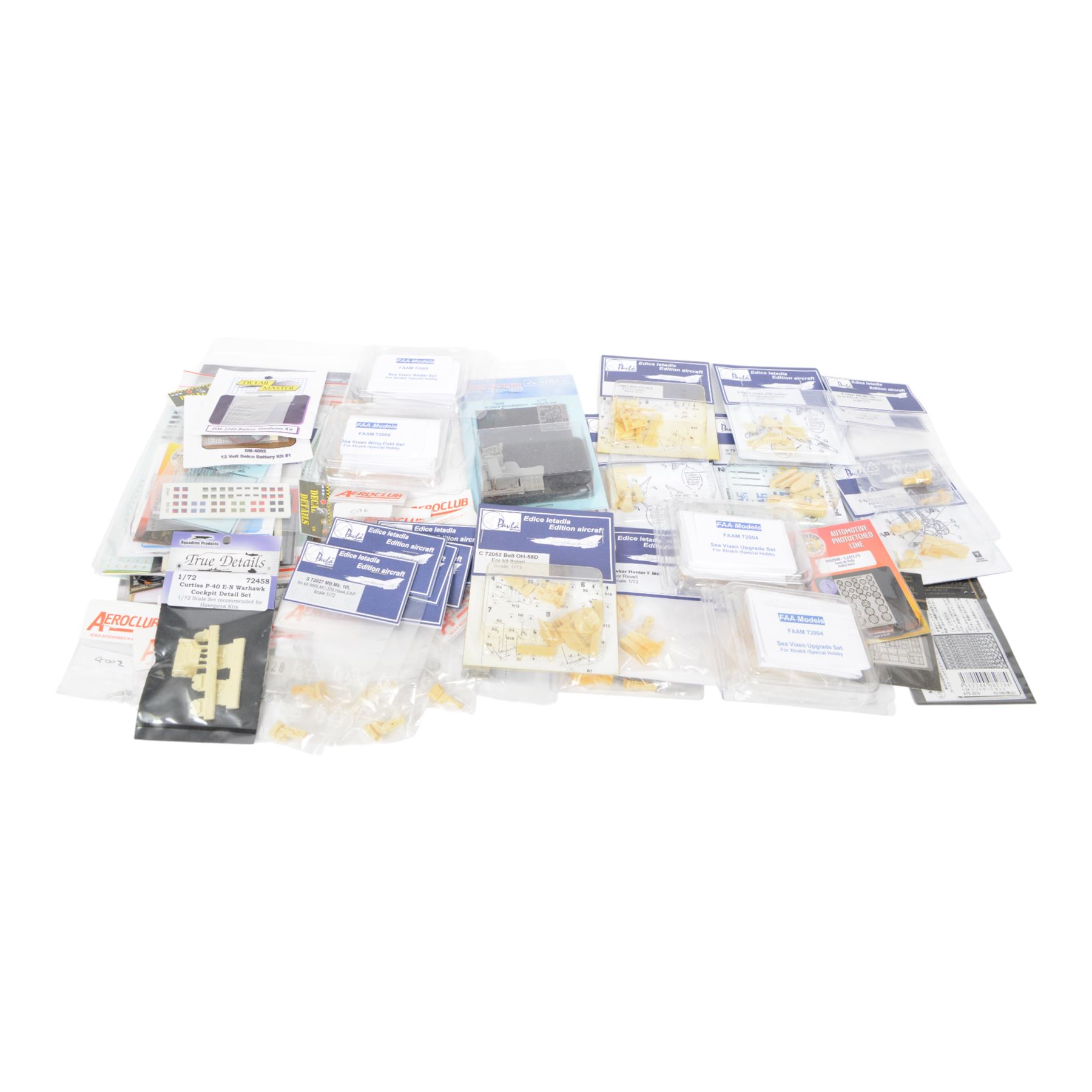 Scale modelling detailing accessories, predominantly for aircraft modelling, including masking sheets, metal parts, white metal weapons, moulded seats, decals, etc all within packaging