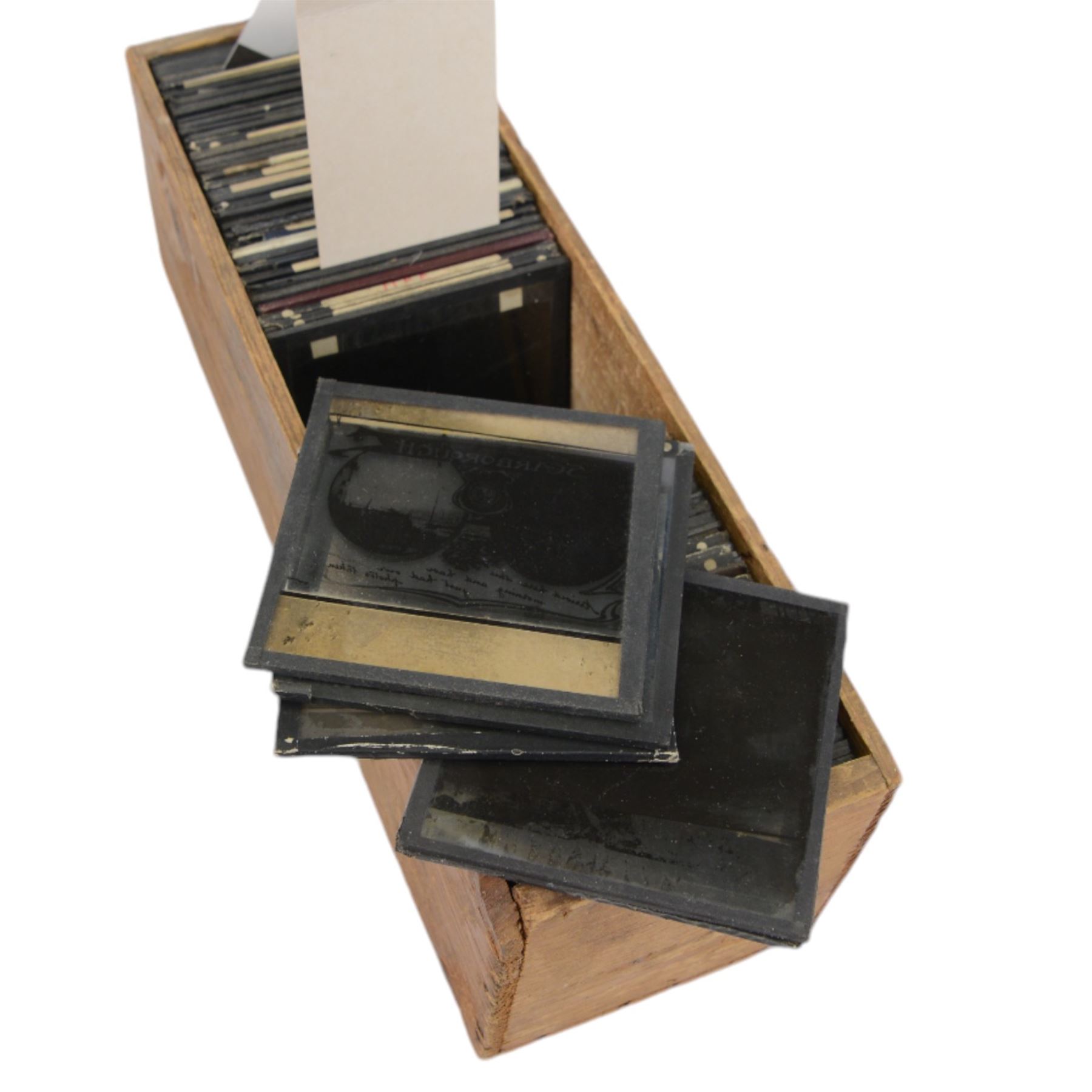 Collection of magic lantern slides, including views of Scarborough, shipping and harbour scenes, animals, travel and tourist views, etc, contained within four wooden cases