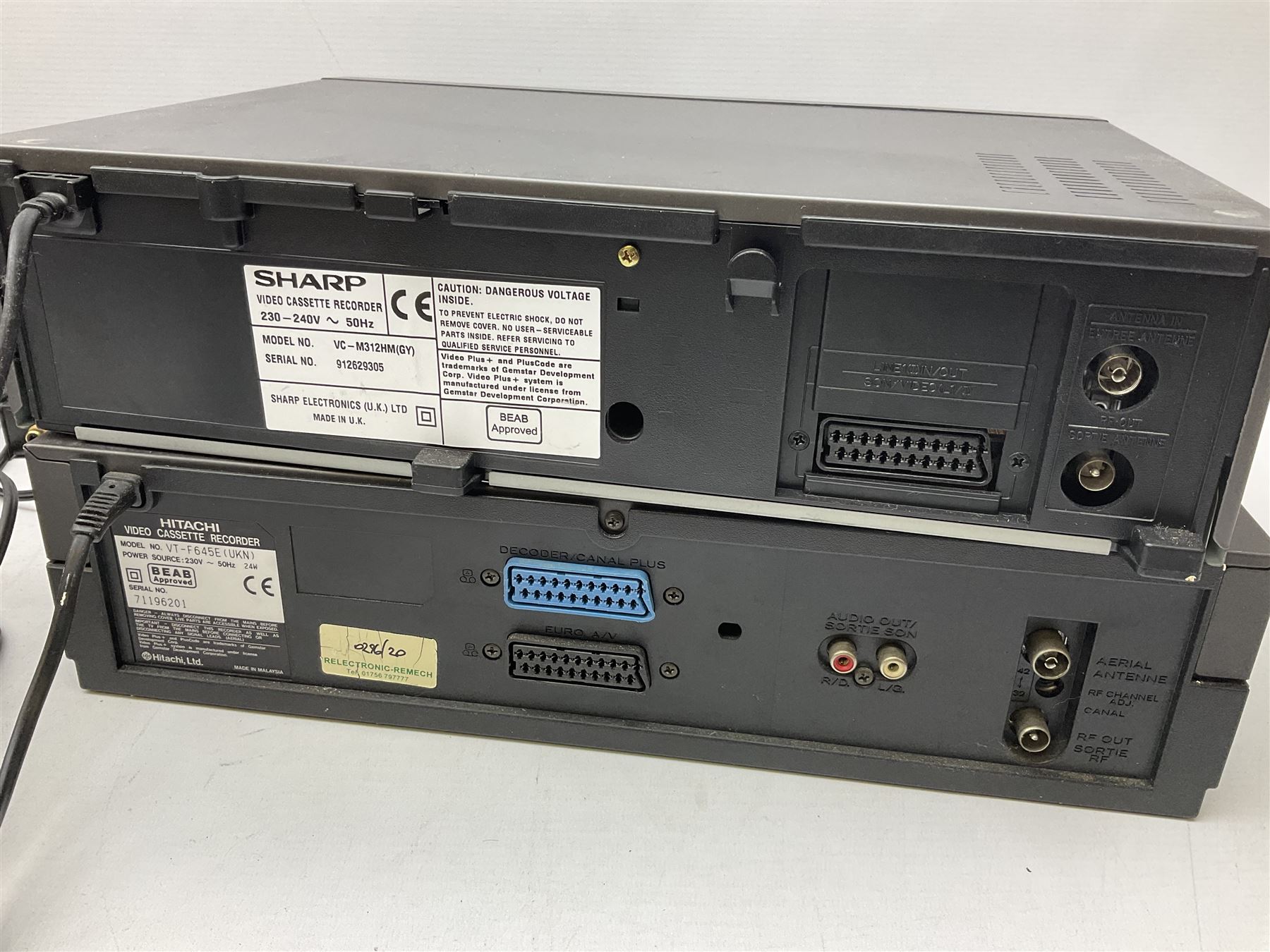 Two VHS video cassette recorders comprising Sharp VC-M312 and Hitachi F645E, together with Philips Digital Terrestrial Receiver, Toshiba VHS 4Head and a record player