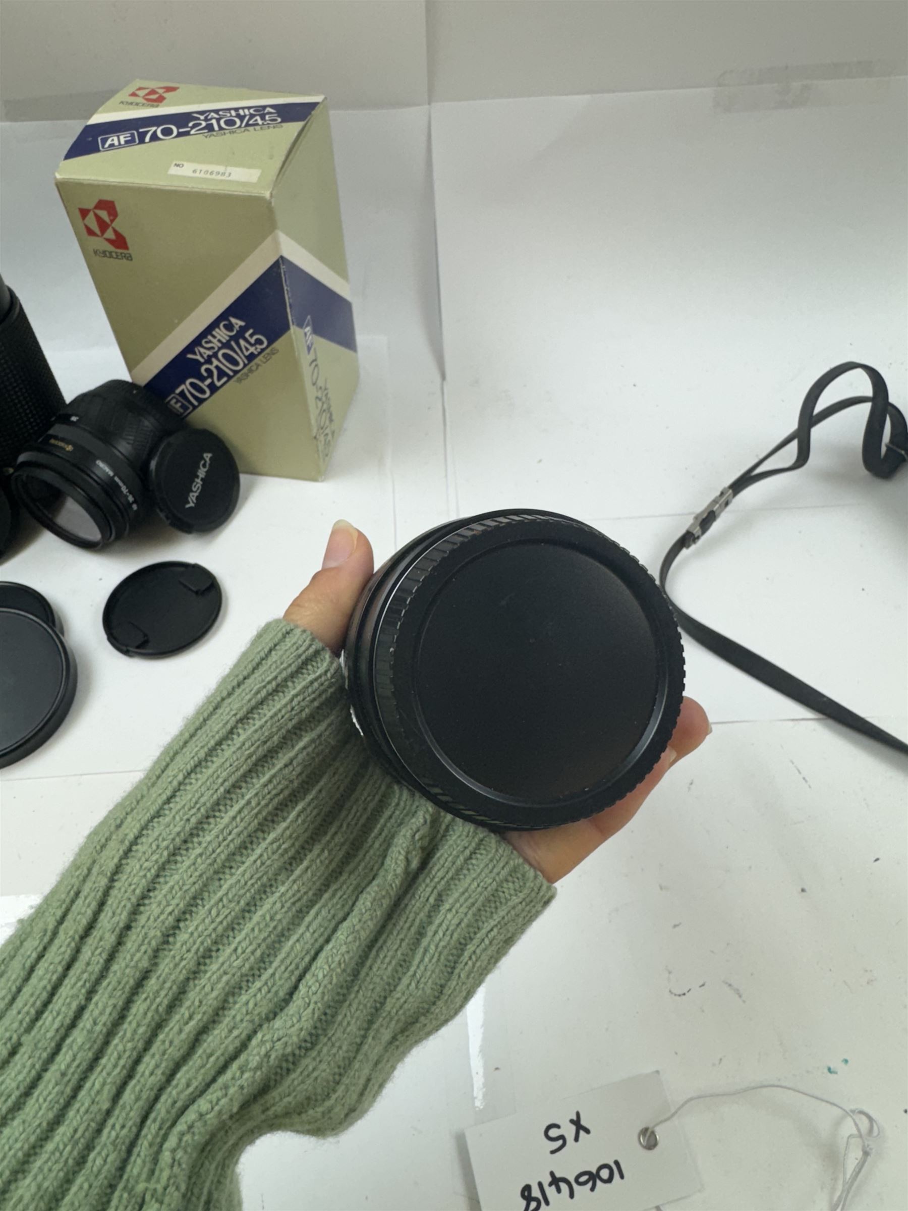 Group of camera lenses, comprising Yashica AF 70-210mm 1:4.5 58mm lens serial no. F6106983, boxed, Yashica AF 35-70mm 1:3.3-4.5 52mm Macro lens serial no. F60231147, Yashikor Aux Wide Angle 1:4 lens and a Yashikor Aux Tele-Photo 1:4 lens, Mamiya-Sekor E 1:2.8 f=28mm serial no. 13427 and a Mamiya-Sekor Zoom E 1:4 f=80-200mm lens serial no. 11271