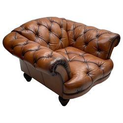 Tetrad - 'Oskar' armchair, Chesterfield shape with rolled arms, upholstered in buttoned tan leather, on turned and reed moulded feet 