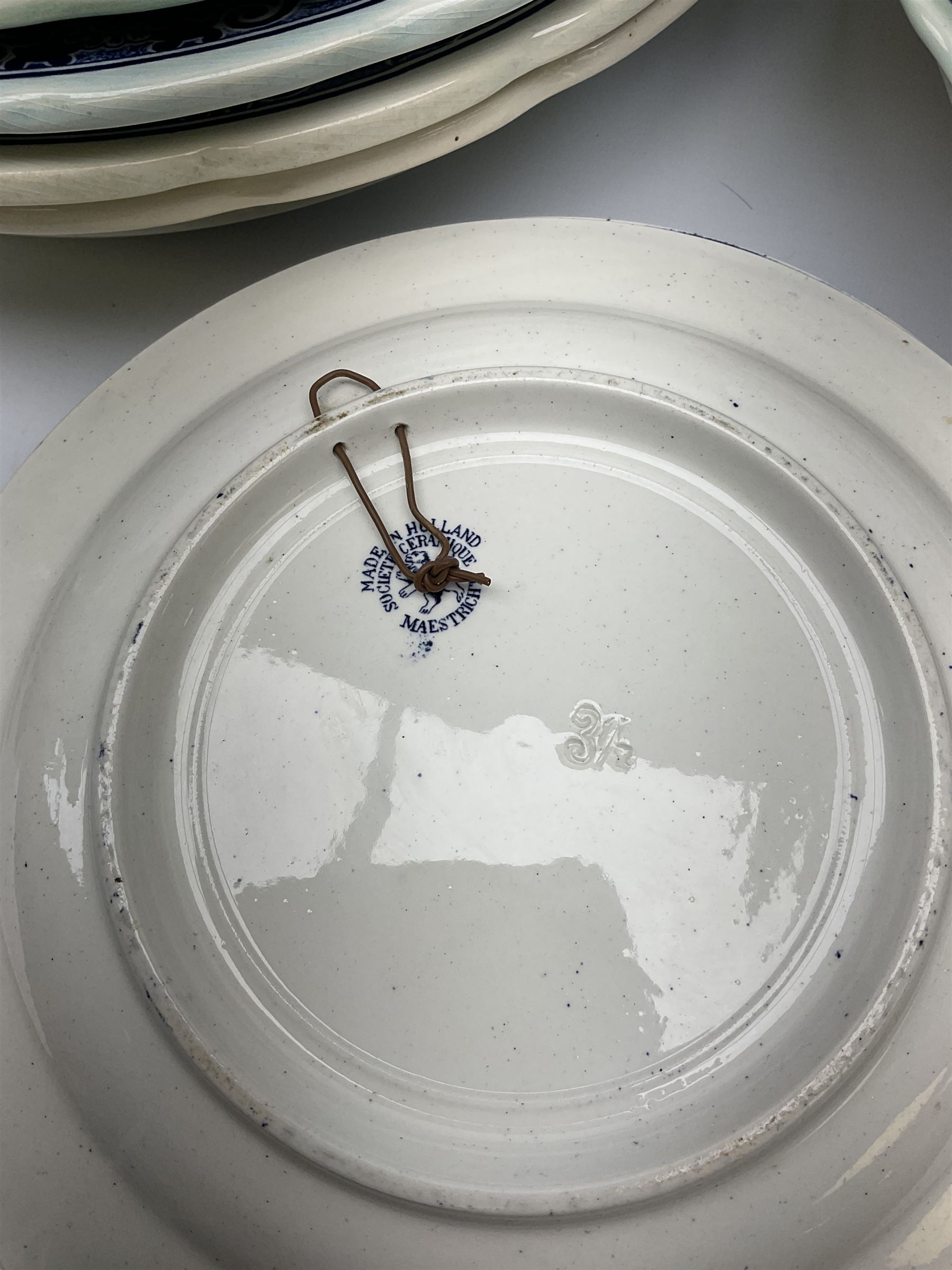 A large collection of modern transfer printed Delft ware, to include large baluster vase, H42cm, two jars and covers, largest H40cm, pair of tapering cylindrical vases, H31cm, and a number of plates of various size and design. 