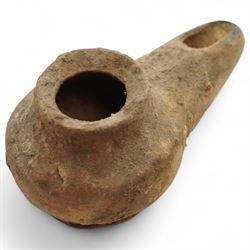 A group of five ancient terracotta oil lamps - Eastern Mediterranean (c.2nd century BC-1st century AD),
comprising a black-slipped Greek lamp (c.2nd-1st century BC) with a rounded body and narrow nozzle; a Herodian lamp (c.25 BC-75 AD) of compact form with central fill hole and pinched wick aperture; a Herodian lamp (c.1st century AD) with central raised disc and dotted ring motif; a Roman/Herodian hybrid lamp (c.50 BC-50 AD) with pronounced rounded shoulders and recessed top; and a further Roman/Herodian lamp (c.50 BC-50 AD) retaining an ancient carbonised wick fragment in the nozzle.
Provenance: By the vendor’s repute, acquired/collected in the Middle East (Dead Sea area/Syria) in the 1960s