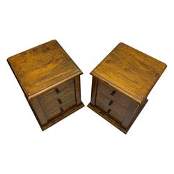 Pair of hardwood bedside chests, square tops with moulded edge, each fitted with three drawers flanked by square pilasters, raised on bun feet
