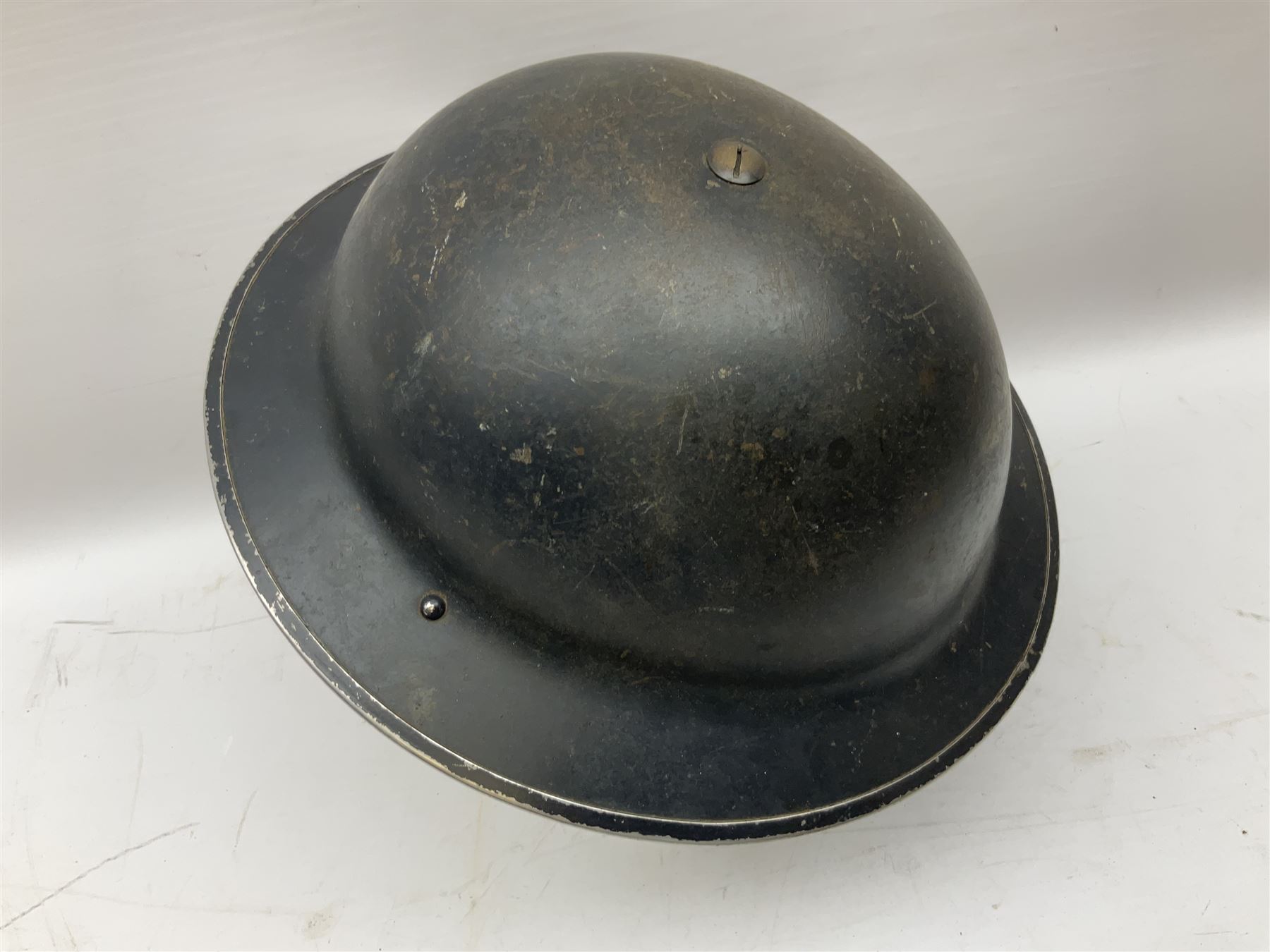 WW2 Home Front 'Police' black painted steel helmet with original liner and webbing chin strap, impressed R.O. Co. 1/1939; and re-painted shell only for WW2 Wardens steel helmet impressed AMC II 1941 C676 (2)