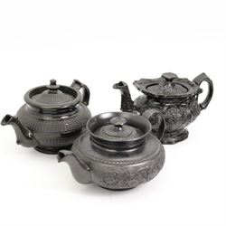 Early 19th century and later black basalt tea wares, mostly with relief or engine-turned bodies, including a Cyples bachelors teapot, other teapots, jugs etc in one box