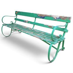 Antique Regency design green-painted wrought iron and slatted garden bench, the scrolled l...