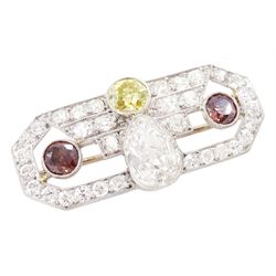 Early 20th century platinum diamond brooch, milgrain set with a pear cut faint brown diamond of approx 1.50 carat, an old cut fancy yellow / green diamond of approx 0.70 carat, and two old cut fancy orange / brown diamonds of approx 0.40 carat and 0.35 carat, surrounded by old cut white diamonds in an openwork setting, total white diamond weight approx 1.45 carat