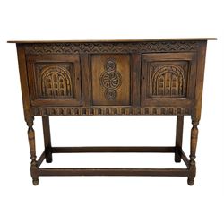 17th century style caved oak side cabinet, fitted with two cupboards, stretcher base