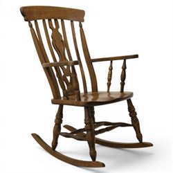Farmhouse elm rocking chair, high back with 'Fleur De Lis' splat, shaped arms above turned...