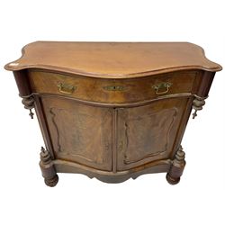 Victorian mahogany serpentine side cabinet, fitted with single drawer over panelled cupboard enclosing single shelf, raised on turned bun feet