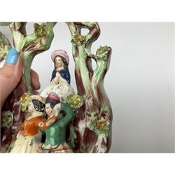 Collection of Victorian Staffordshire and Staffordshire style pottery, to include Prince of Wales on horseback, pair of lovers on a spill vase, pair of greyhound penholders, pocket watch holder modeled as a castle, etc.  