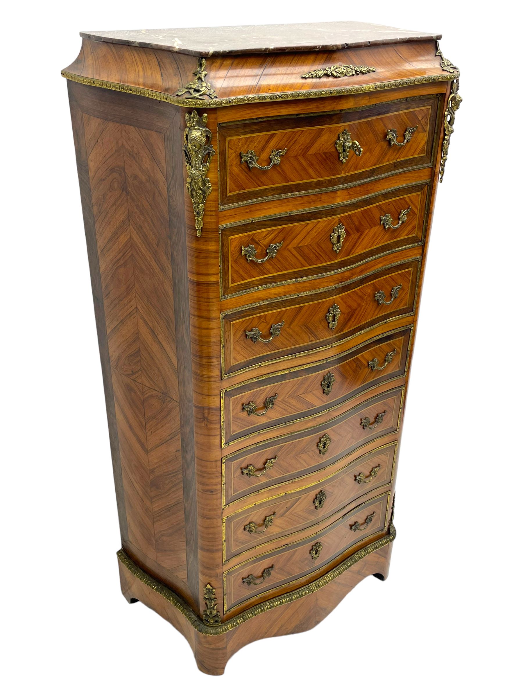 Mid-20th century Louis XVI design Kingwood and walnut secretaire à Abattant, shaped serpentine form with dark rouge variegated marble top, the fall front disguised as three drawers enclosing birdseye maple interior with shelf, drawers and writing surface, four functioning drawers below, decorated with cast gilt metal mouldings and mask cartouches, on skirted base with egg and dart moulded gilt metal edge
