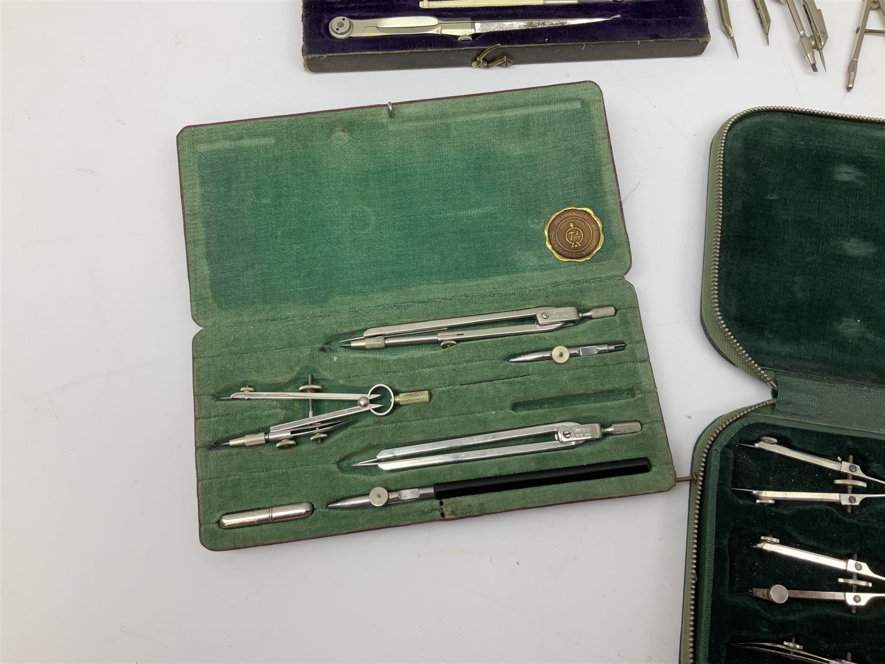 Negretti & Zambra drawing instrument set, the ruler with manuscript name 'F/Sgt. F. Hamilton R.A.F. 194(?)', cased; four other drawing instrument sets by Anker-Precision Germany, EcoBra, Temple etc, all cased; and quantity of loose drawing instruments