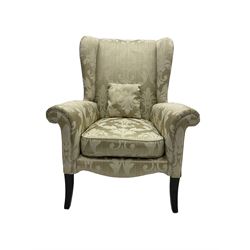 Parker Knoll - wingback armchair upholstered in champagne fabric with foliate pattern