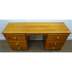  Solid pine twin pedestal dressing table, moulded top, six drawers, shaped plinth base (W150cm, H72cm D45cm), a narrow pine chest, two drawers, single cupboard (W43cm, H93cm, D41cm), solid pine bedside chest, three drawer and a wall hanging unit, two shelves and three drawers (4)  