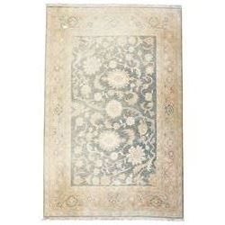 Indo-Persian indigo ground carpet, the field decorated with large palmette motifs connected by scrolling foliate, enclosed nu wide guard bands decorated with repeating interlaced stylised plant motifs