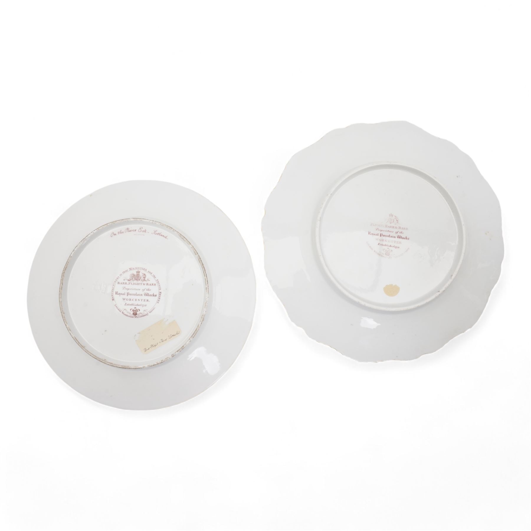 Flight, Barr & Barr Worcester porcelain cabinet plate, centrally painted with two figures admiring the landscape, within a gilt seaweed border, printed marks beneath, D22.5cm, together with a Barr, Flight & Barr Worcester cabinet plate, painted with a view of the River Esk, Scotland', within a peach and gilt seaweed border, titled 'On the River Esk - Scotland' and printed marks beneath (2)