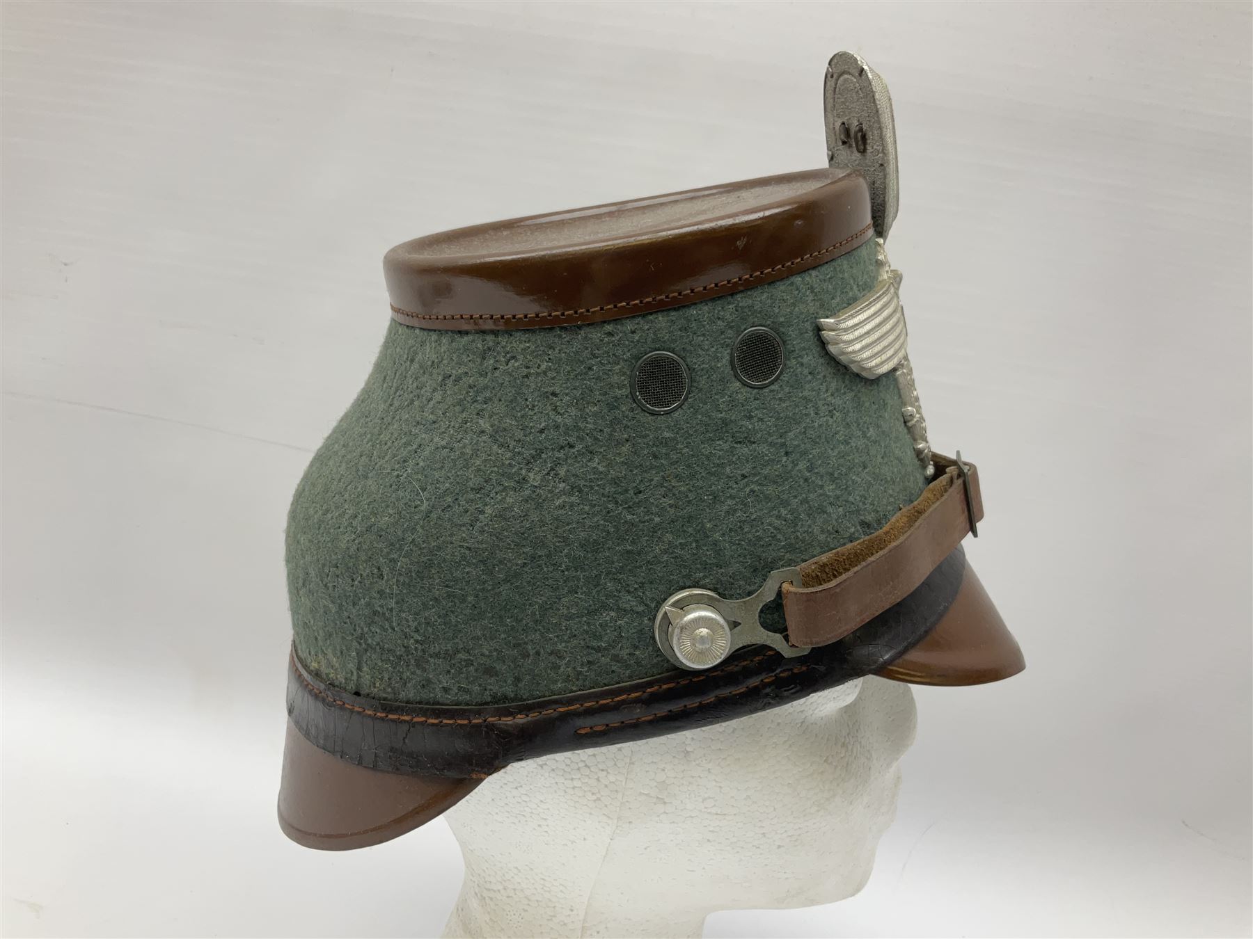 WW2 German rural police shako with helmet plate and liner; bears label 'Hans Romer Echt Fiber-Tschako Neu-Ulm (Donau)'