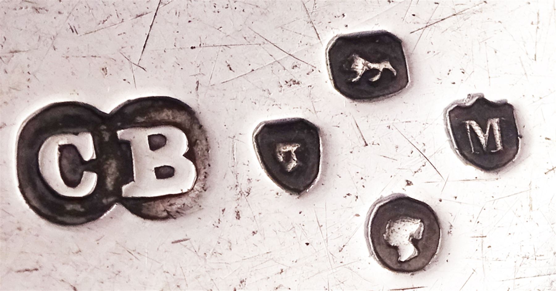 Group of five mid 20th century silver napkin rings, comprising a pair of plain circular form engraved with initial, hallmarked Viner's Ltd, Sheffield 1932, a circular example with engine turned bands, hallmarked R N Hollings & Co, Birmingham 1945, and two further 1930's examples, hallmarked Birmingham 1930 and 1934, various makers, together with a small early 20th century silver cream jug, of bellied form with foliate embossed decoration and scroll handle, hallmarked Walker & Hall, Sheffield 1910, including handle H6.5cm, etc.,  approximate total weight 8.98 ozt (279.3 grams)