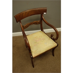  19th century mahogany Recency style armchair, curved figured top rail above carved horizontal rail, down swept scrolled arms. upholstered drop in seat, sabre supports, W53cm  