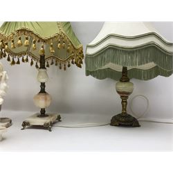 Onyx table lamp, with knopped stem and cream and green tassel shade, together with three smaller similar onyx lamps, classical style alabaster figures and a covered onyx jar