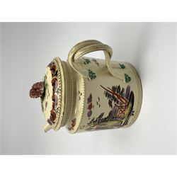 18th century creamware teapot, probably Leeds, with reeded entwined handle and floral finial to the cover, the body with hand painted polychrome decoration of figure to one side, and floral spray to the other, collectors paper label beneath inscribed Leeds Pottery, H11.5cm
