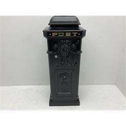 Reproduction Victorian style black painted aluminium floor standing post box, with lion mask decoration to the front, with keys