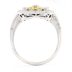18ct white gold diamond flower head dress ring, milgrain set with sixty-five fancy yellow and white diamonds, with diamond set shoulders, stamped 750, total diamond weight 1.00 carat, with World Institute Report