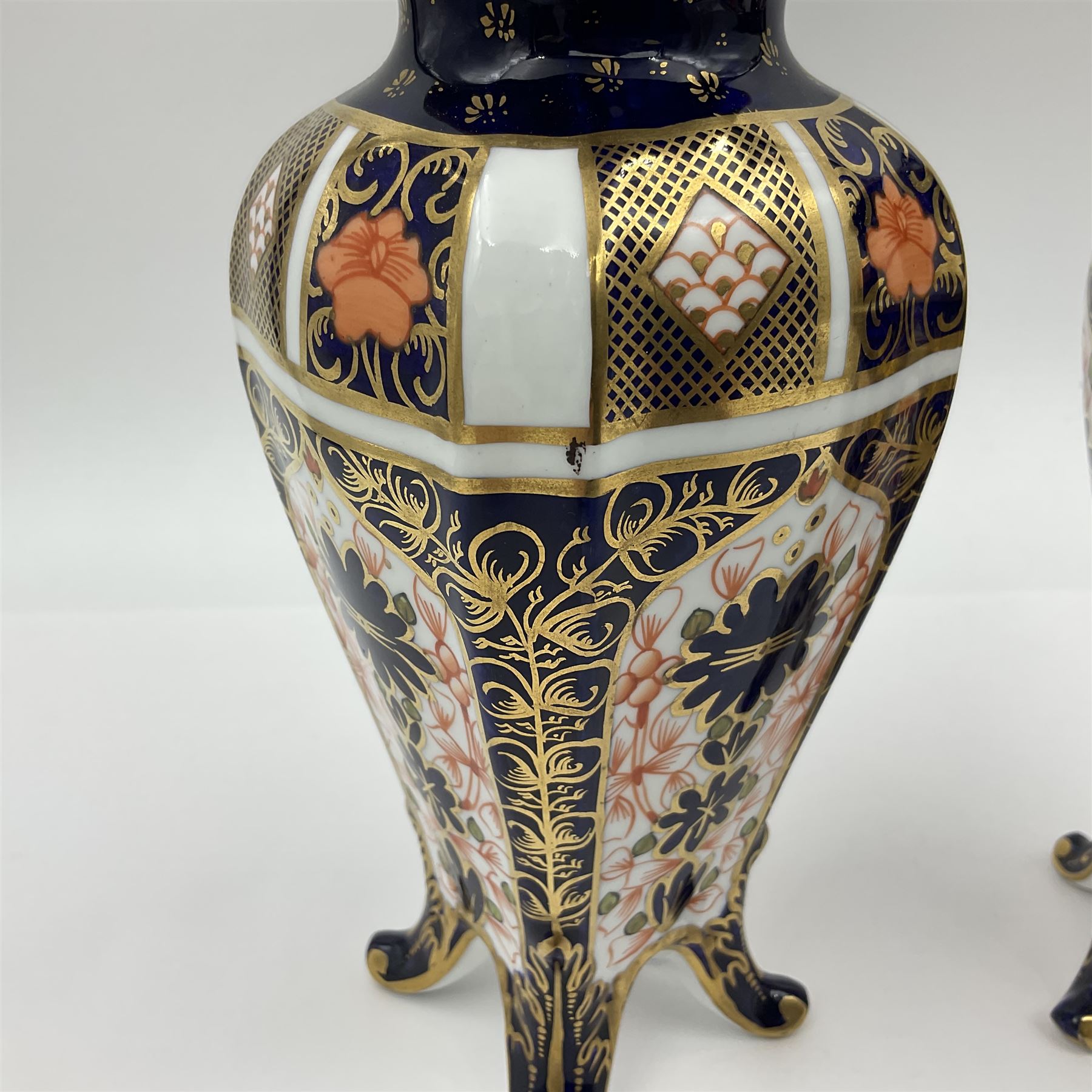 Pair of early 20th century Royal Crown Derby Imari 1128 pattern vases, of tapering straight sided form with waisted neck and frilled rim, upon four splayed feet, with printed and painted marks beneath including illustration date codes for 1911 and 1920, H17cm