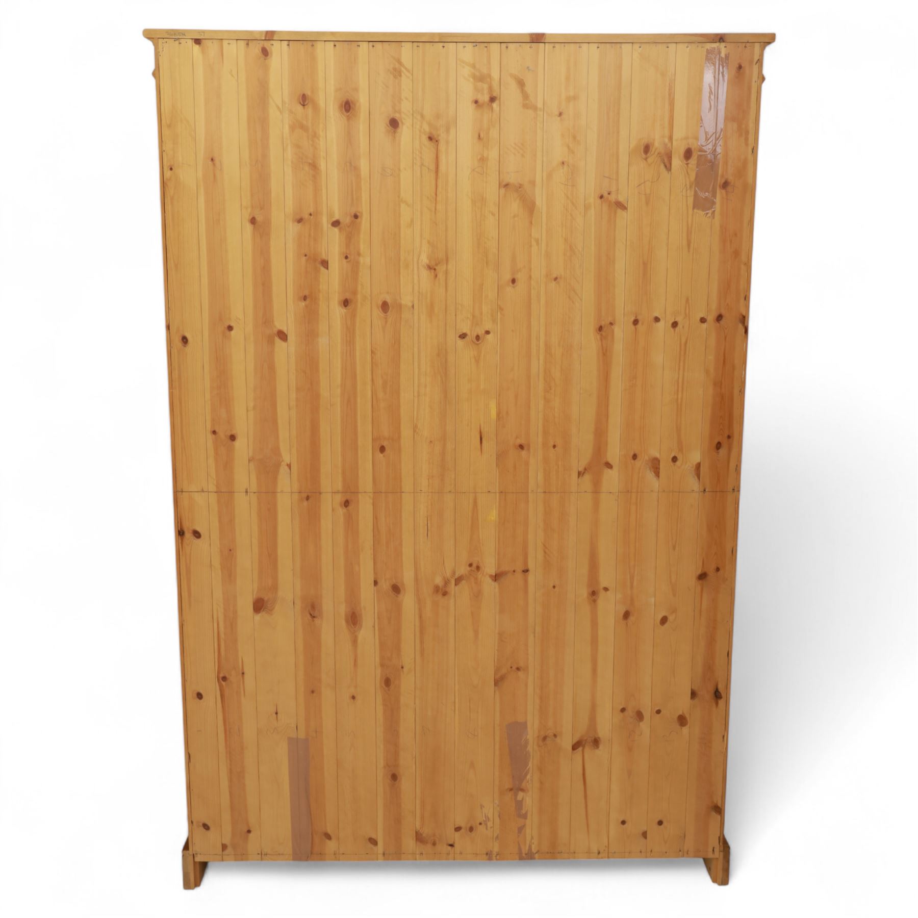 Contemporary pine open bookcase, the rectangular form with fluted uprights, tongue and groove back and five adjustable shelves