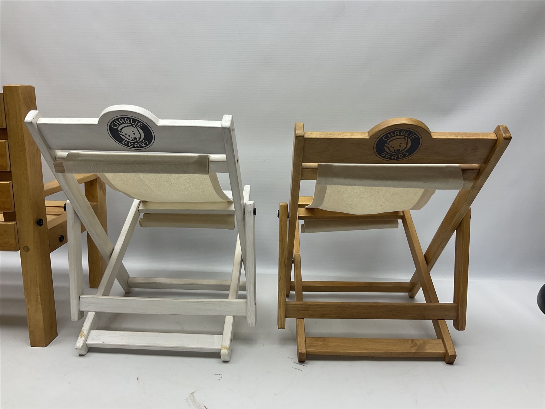 Charlie Bears bench, H41.5cm L58.5cm D29.5cm, and two Charlie Bears deck chairs, each approximately H37cm, together with a limited edition Silver Tag Bear, Logan Bear, 226/1,500, with tag, and two further bears, (6)