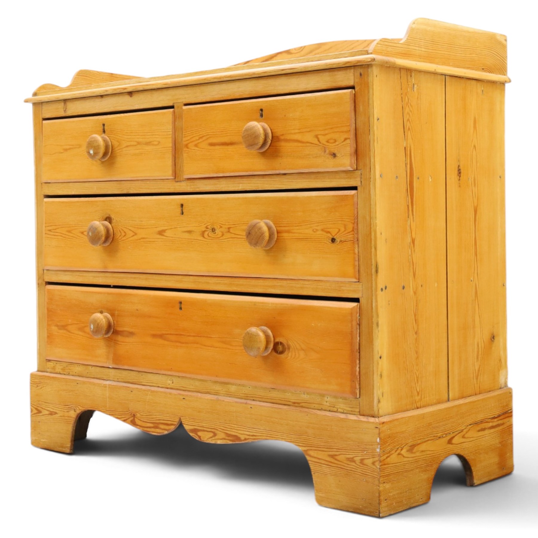 Victorian pine chest, galleried three quarter top, fitted with two short and two long drawers. with shaped apron and supports