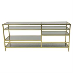 Modern glass and gilt metal media stand, rectangular smoked glass top panel set within a gilt finished metal surround, raised on square section legs, the underside fitted with a full-width glass shelf