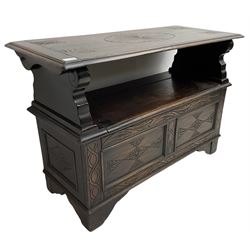 17th century design stained oak monks bench, hinged metaphoric table back, over hinged box seat compartment, the panelled front carved with foliate decoration and lozenges