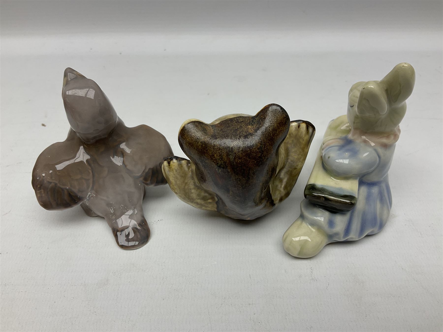 Three Beswick figures of horses, comprising Palomino foal 915, Dapple Grey foal and bay, together with Bing & Grondahl 1852 fledging sparrow modelled as a hungry baby bird and two other animal figures