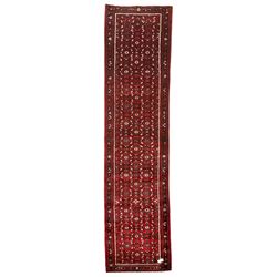 North West Persian Malayer runner, red ground field decorated with Herati motifs, guarded border decorated with trailing flowerhead band 