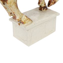 Owen Thorpe, studio pottery horse, standing with one leg raised, upon a rectangular plinth, H35cm 