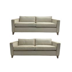 Neptune - pair three seat 'Shoreditch' sofas,  upholstered in cream fabric with yellow stringing