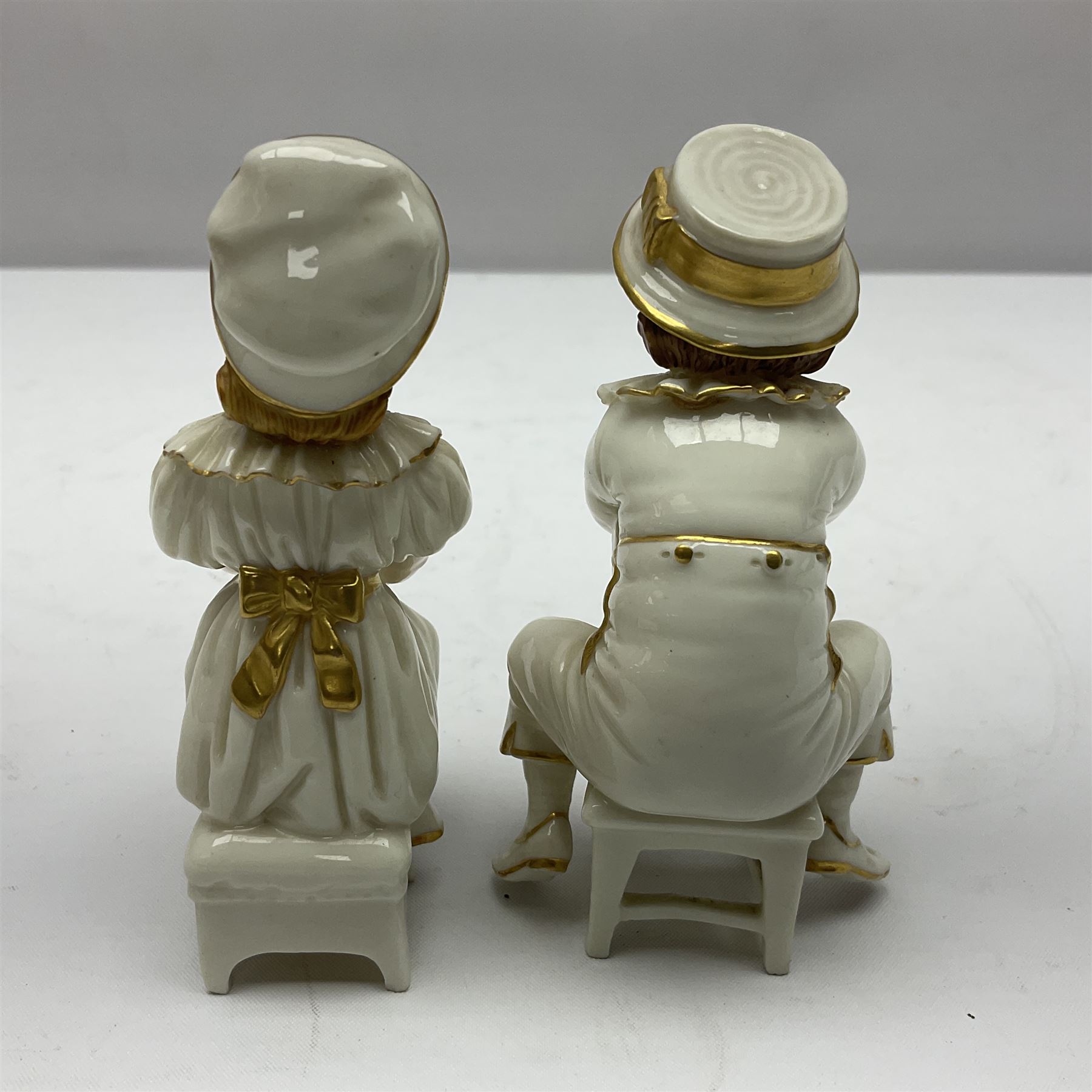 Royal Worcester tusk jug, blush ivory ground, with floral design, stamped 1116 to the base,, together with pair figures of a young boy and girl in the style on Kate Greenaway 