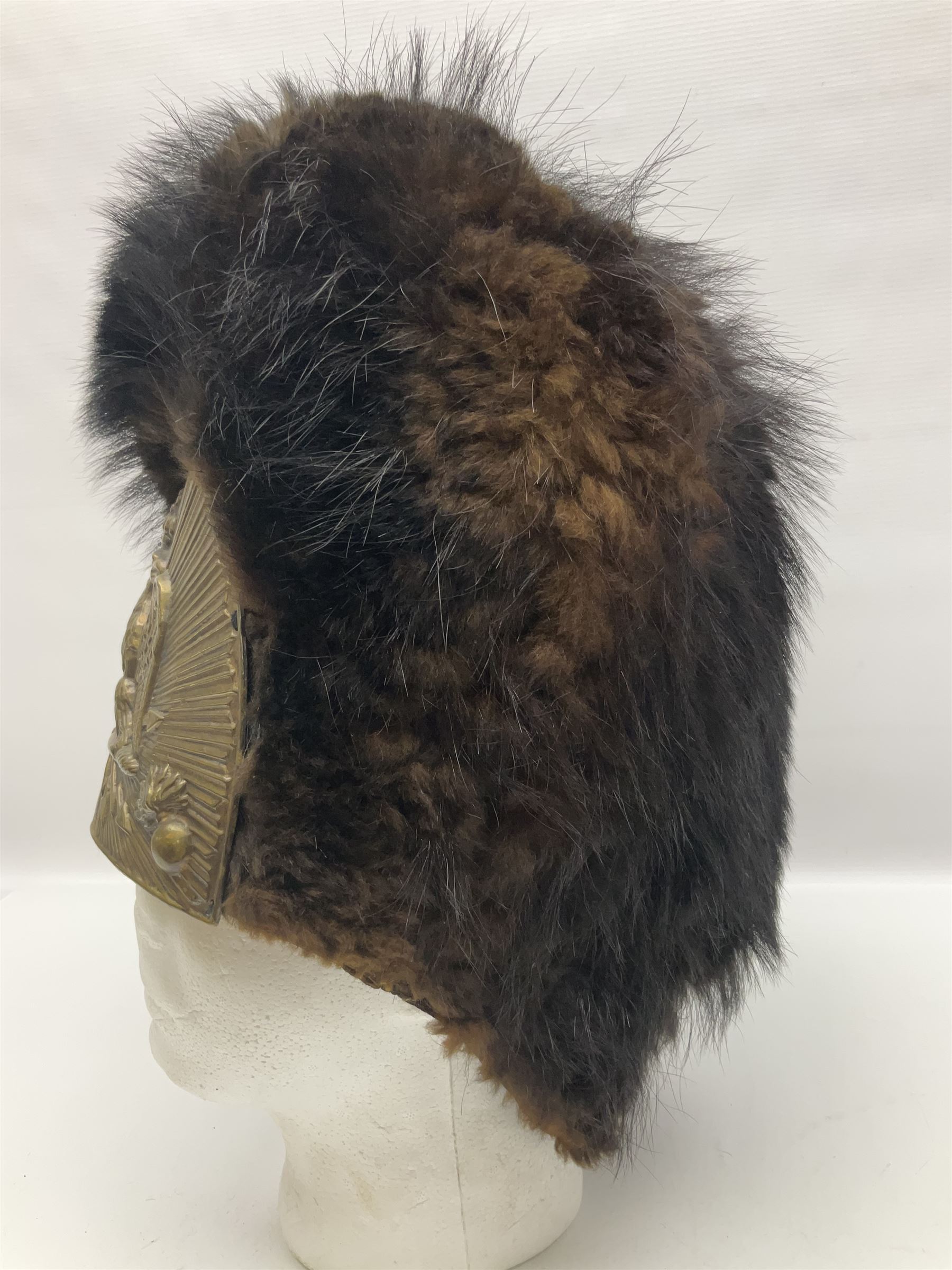 French Grenadier's bearskin hat, the embossed brass plate with crowned eagle, flaming grenades and arrow flashes; leather headband and traces of manuscript label internally