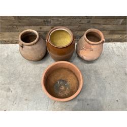 Pair of terracotta water jugs, H46cm, glazed pancheon and a circular planter (4)