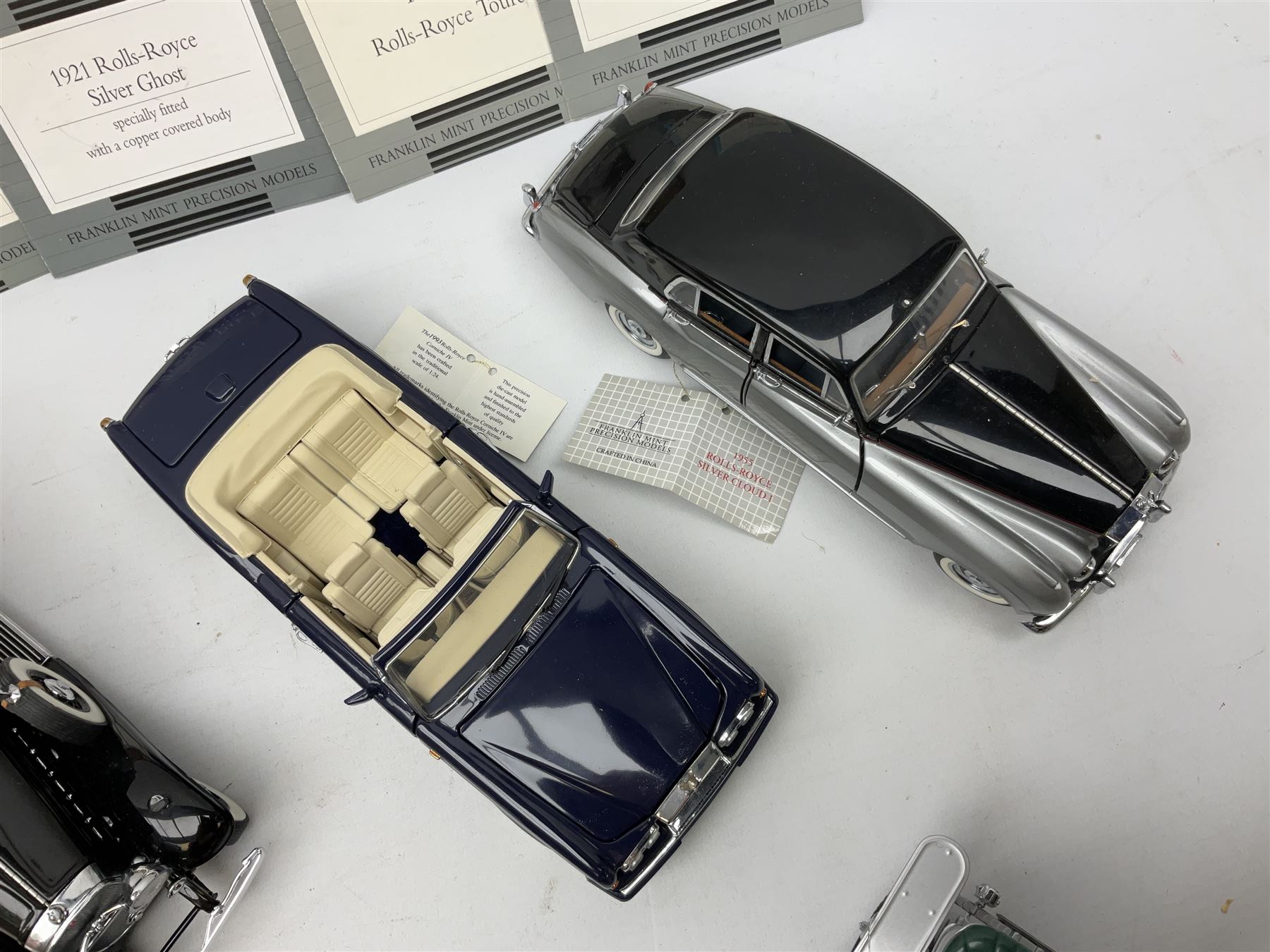 Eight Franklin Mint diecast models of cars, 1911 Rolls-Royce Tourer, The Rolls-Royce Corniche IV, The Mercedes Simplex, 1955 Rolls-Royce Silver Cloud, 1921 Rolls-Royce Silver Ghost, 1907 Rolls-Royce Silver ghost,1929 Rolls-Royce Phantom I,  and 1930 V-16 452 Cadillac Imperial Sedan, all with original tags attached