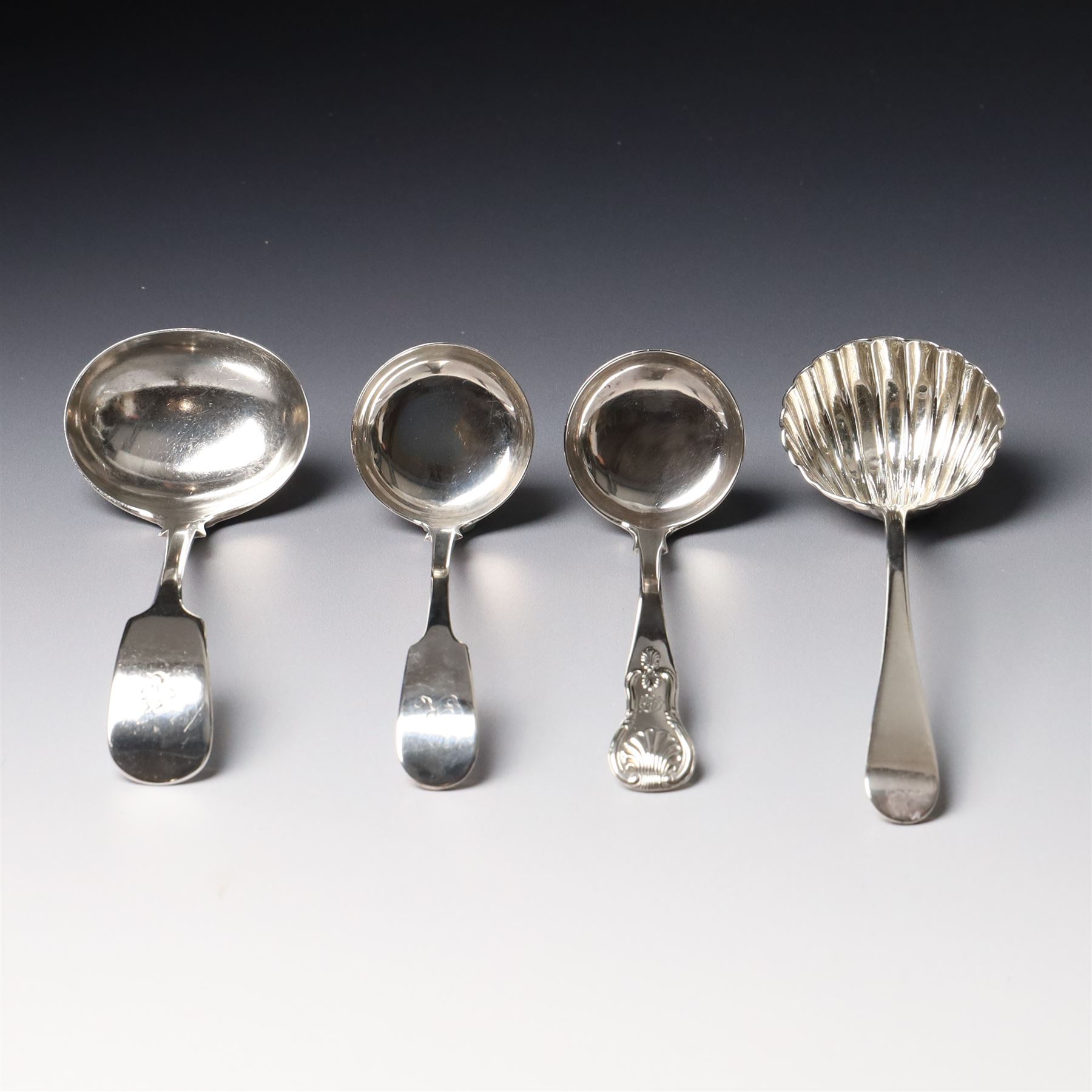 19th century Scottish silver fiddle pattern toddy ladle, Edinburgh 1837 Maker Millidge & Son, another Edinburgh 1835 Maker James McKay, George IV silver sauce ladle with fluted bowl London 1825 Maker Charles Eley and an Edwardian sauce ladle (4)