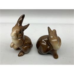 Collection of Beswick figures to include recumbent fox no.1017, standing fox, probably Beswick no.1016a, two other smaller Beswick fox figures, and four Beswick rabbit figures modelled as rabbits to include no.824, no.825 and no.823 (8) 
