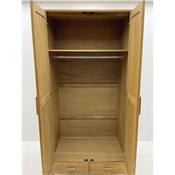 Solid oak double wardrobe, fitted with two drawers to base