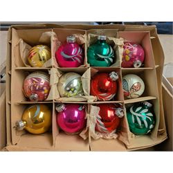 Collection of colourful vintage Christmas decorations, including glass and metal baubles
