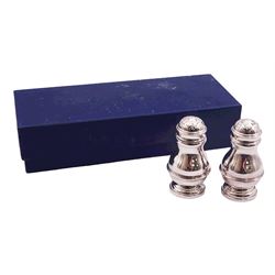 Pair of modern silver peppers, of baluster form with girdle, hallmarked David Shaw Silverware Ltd, London 1983, H7.5cm, contained in fitted box, approximate silver weight 2.84 ozt (88.6 grams)