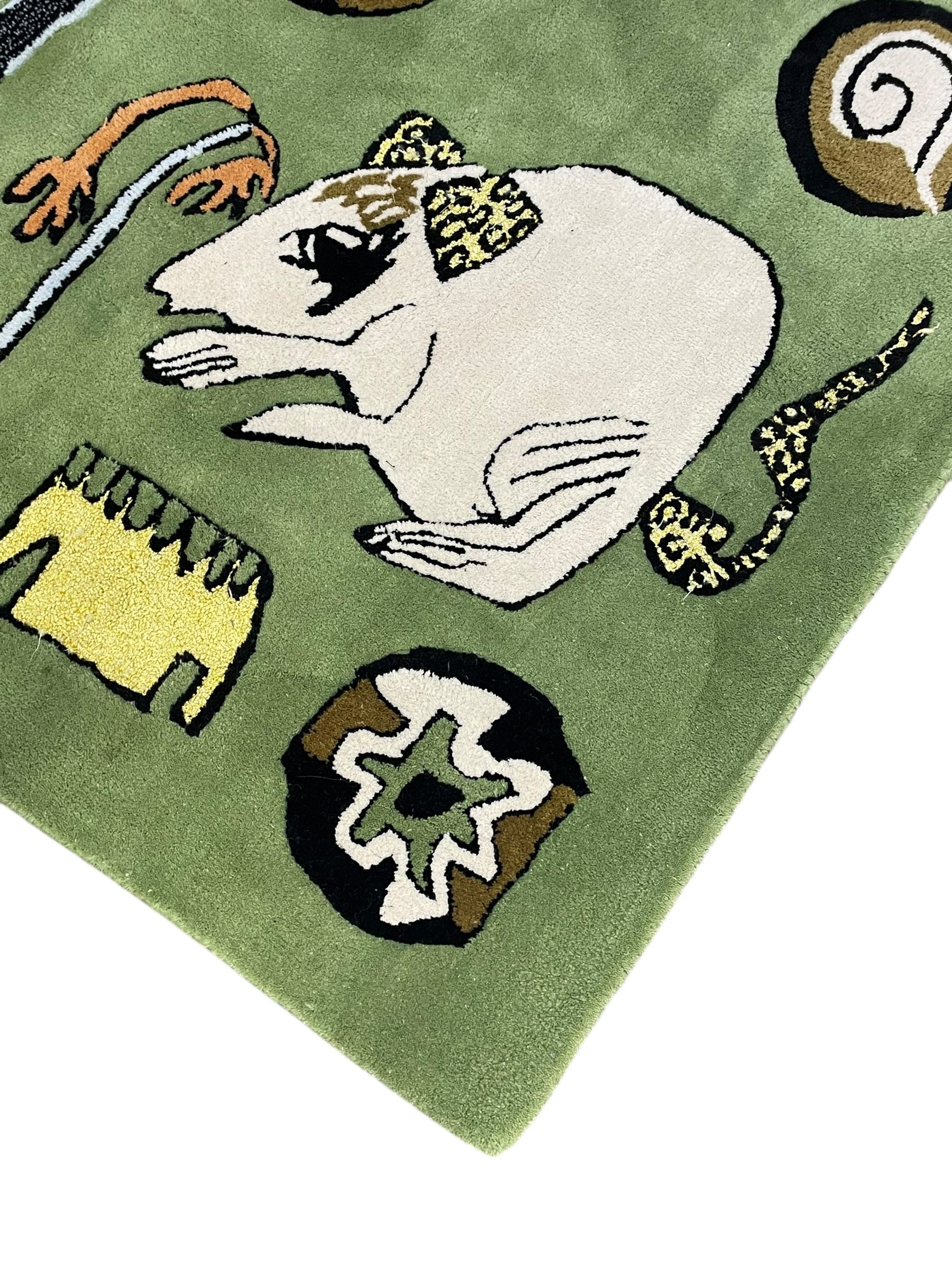 Shrimps for Habitat - 'Wilder' hand tufted green ground rug decorated with abstract motifs of animals, faces, shells and houses 